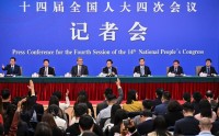 中国人民银行行长潘功胜出席十四届全国人大四次会议经济主题记者会